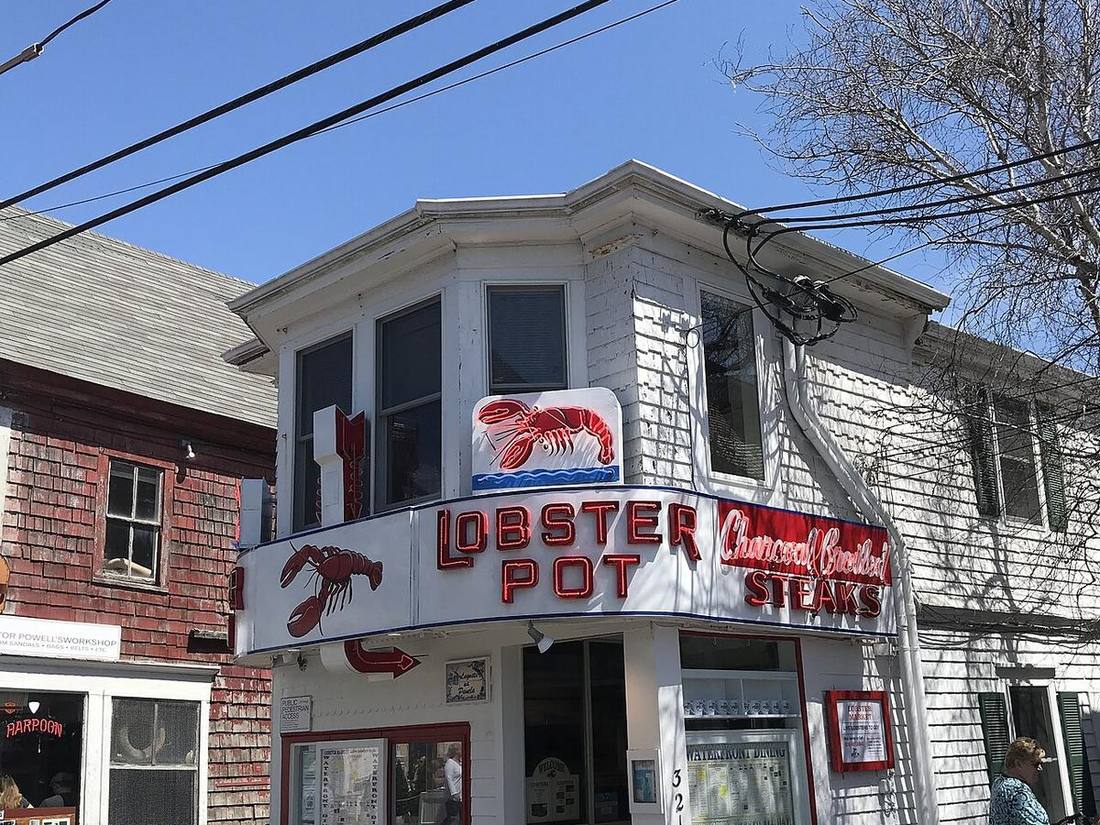 The Lobster Pot restaurant on Commercial Street, white clapboard with its red neon sign