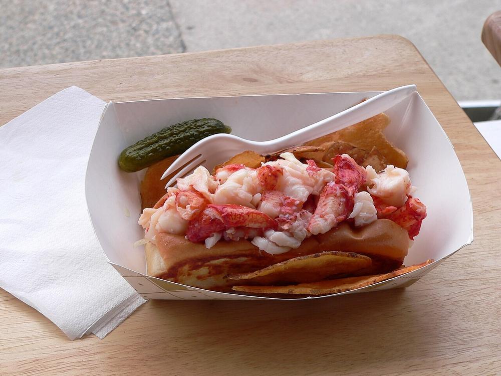 A lobster roll in a paper tray